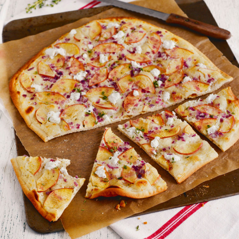 Flammkuchen is like a little version of pizza with a thin base fully covered with white cheese